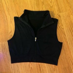 Ladies athleisure sleeveless with collar zip up front top